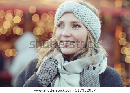 Christmas portrait of the girl and the decoration of the city