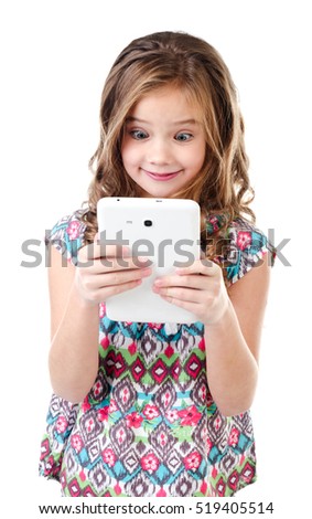 Cute surprised little girl with tablet pc isolated on a white education and internet concept 