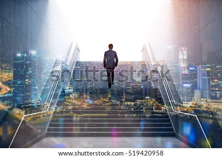 Rear view of a businessman climbing stairs to get to a large city center. Concept of success and appreciation. Double exposure Royalty-Free Stock Photo #519420958