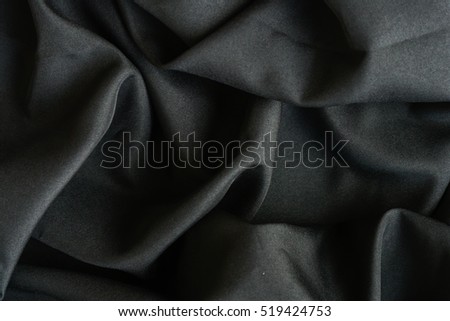 Dark wavy glossy silk drapery,  Rumpled fabric.