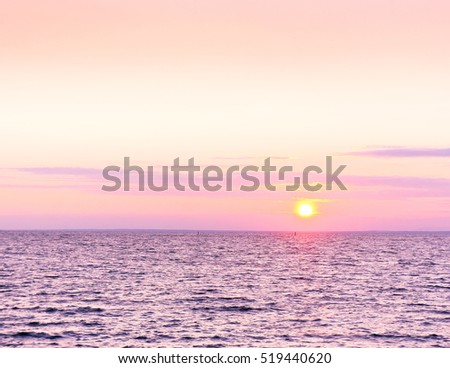 Bright Illumination Sunset over Water 