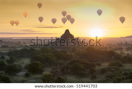 Hot air balloon over plain of Bagan in misty morning, Magical sunrise over the temples in Bagan, Myanmar.