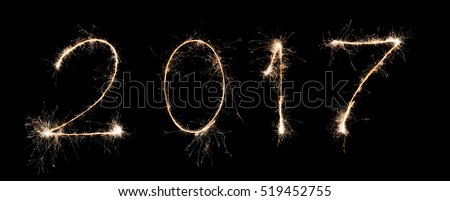 Text font 2017 firework written with Sparkle on black background sign calendar of happy new year 