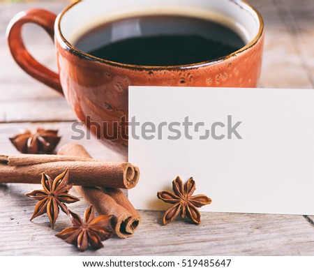 good morning concept. A cup of coffee and spices on wooden table