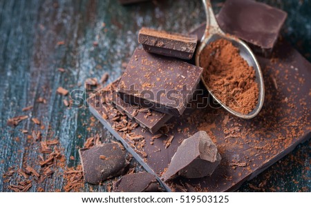 dark chocolate over wooden background, selective focus Royalty-Free Stock Photo #519503125