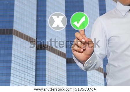 Finger of Businessman touch to green button and white check mark,Concept of decisions in business and advertising.