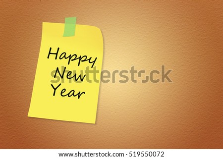 Paper note with sticky tape isolated on background textured brown