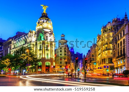 Madrid, Spain. Gran Via, main shopping street at dusk. Royalty-Free Stock Photo #519559258