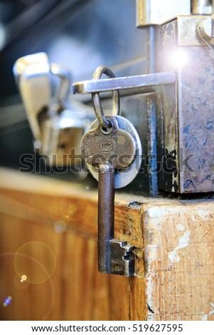 Old style key hanging on a locker