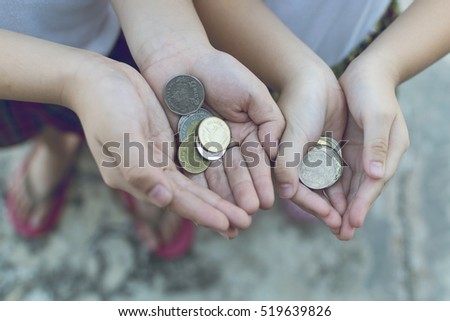 Coin in children hand. Business and finance concept