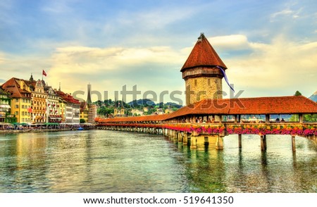 Chapel Bridge and Water Tower in Luzern - Switzerland Royalty-Free Stock Photo #519641350