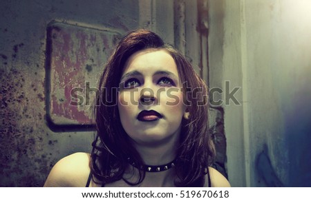 emo girl with beautiful hair on  Grunge background 