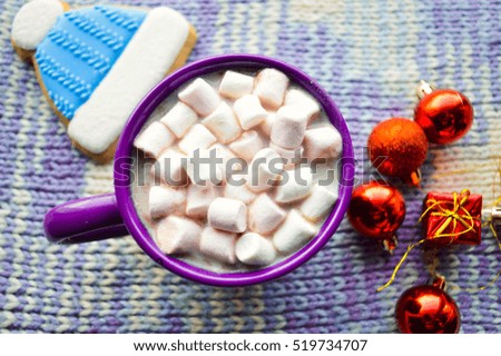 Hot chocolate with marshmallows and spices on wooden background.Christmas gingerbread