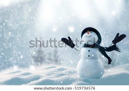 Merry christmas and happy new year greeting card with copy-space.Happy snowman standing in winter christmas landscape.Snow background Royalty-Free Stock Photo #519736576