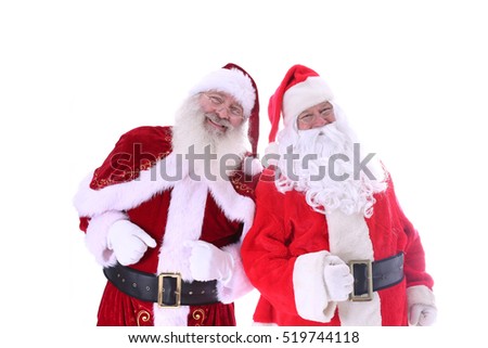 Two Santa Claus friends pose together. isolated on white with room for your text
