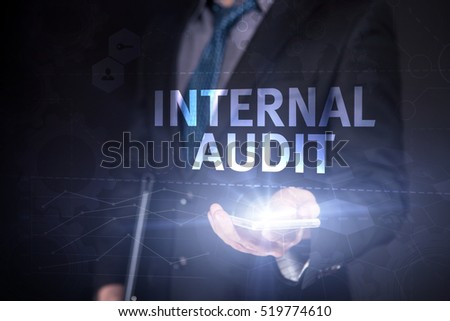 Businessman Use Smartphone And Selecting Internal Audit, Touch Screen. Virtual Icon. Graphs Interface. Business concept. Internet concept. Digital Interfaces