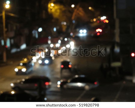   Evening traffic. The city lights. Motion blur. Abstract background.                                 