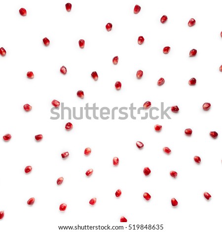 Fruit pomegranate seeds scattered in a chaotic manner, isolated on white background. Food background. Royalty-Free Stock Photo #519848635