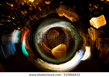 High resolution Abstract glowing defocused circle motion blurred background in dark vivid red, green, yellow, blue