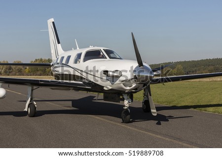 Small private single-engine piston aircraft on runway during.