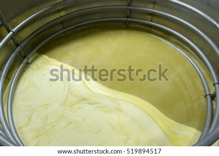 Inside aluminum fermentation vat with corn mash and water in craft bourbon distillery. Royalty-Free Stock Photo #519894517