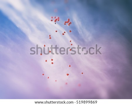 Countless red love balloos flying to heaven against sky background. 
Heart shaped balloons on blue sky, image for wedding cards concept, bridal blogs and magazines, lens flare, retro filter effect
