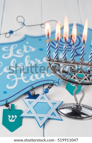 Image of jewish Hanukkah holiday with menorah burning candles.