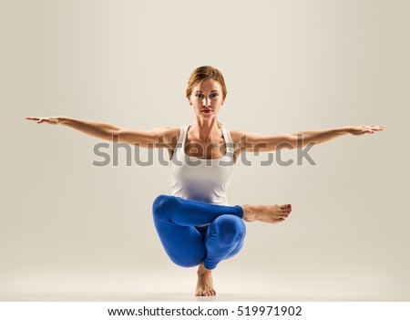 young beautiful yoga pose. balancing on one leg