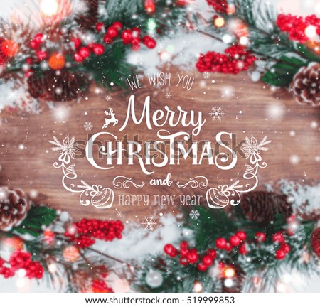 Christmas and New Year typographical on holiday background with Xmas decoration, branch of fir tree and snow. Merry Christmas and Happy New Year theme