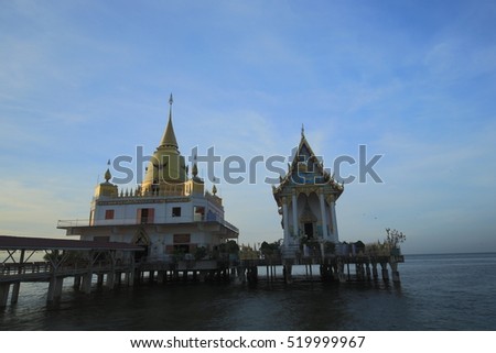 Buddhist church and pagoda in the sea, The temple named Wat Hong Thong mean golden swanlake temple in Chachoengsao province with  beautiful sky in the morning, Thailand 