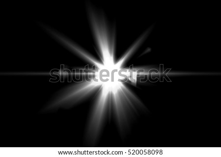Abstract lens flare light over black background Royalty-Free Stock Photo #520058098