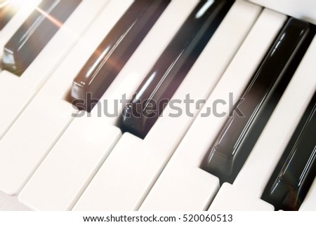 Electronic musical keyboard synthesizer close-up. Soft focus.