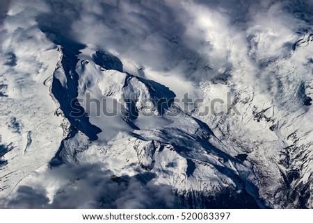 aerial view, snow covered mountain ridge with glacier