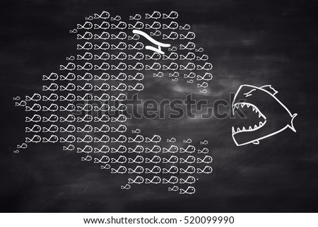 Tiny fish eating big one on chalkboard background. Teamwork and competition concept