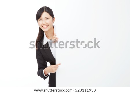 smiling Japanese businesswoman with Bulletin Board