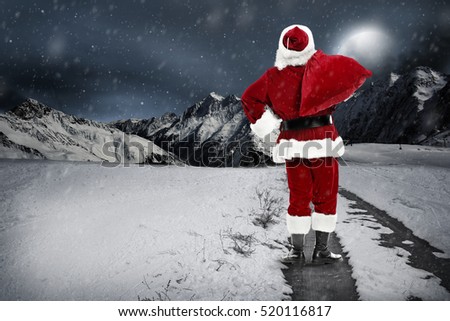 santa claus on winter road and night 
