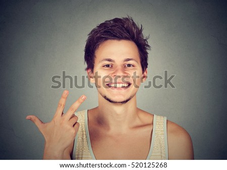 man giving a three fingers sign gesture with hand isolated on gray background