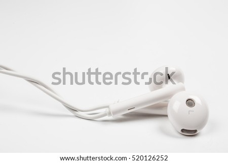 Close-up Earphone or earphones on white background.the white earphones for using digital music or smart phone.