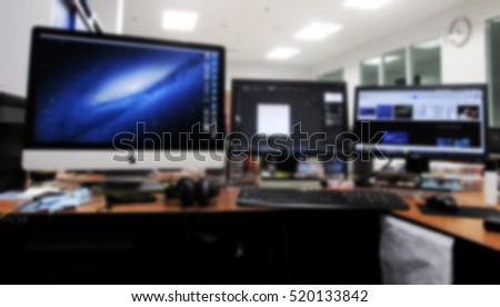 Workstation computer in post production graphics studio Blur image use for background. 