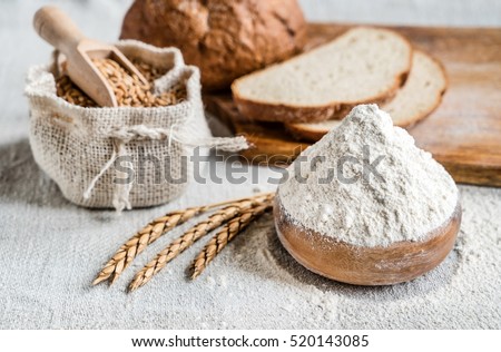 wheat and flour on the table Royalty-Free Stock Photo #520143085