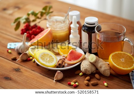 health, traditional medicine and ethnoscience concept - natural and synthetic drugs on wooden table Royalty-Free Stock Photo #520158571