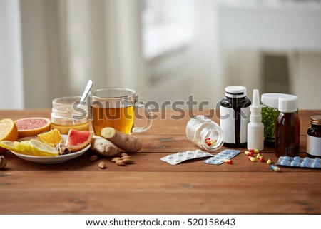 health, traditional medicine and ethnoscience concept - natural and synthetic drugs on wooden table Royalty-Free Stock Photo #520158643