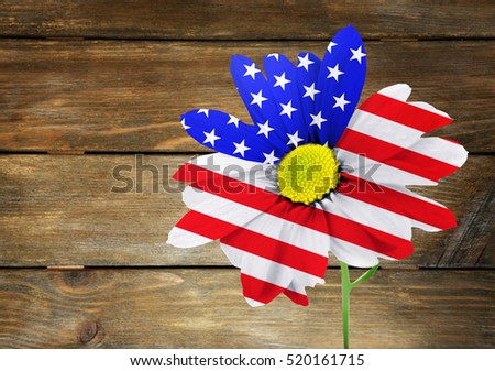 USA flag design of flower on wooden background