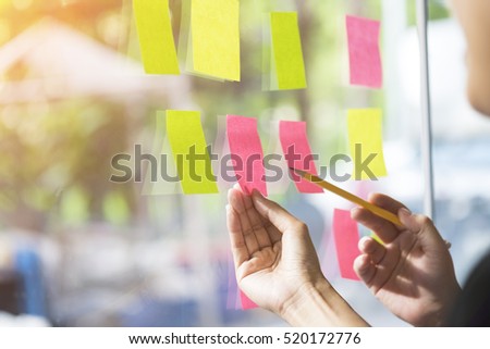business people having a meeting in office, business people post it notes in glass wall, soft focus Royalty-Free Stock Photo #520172776