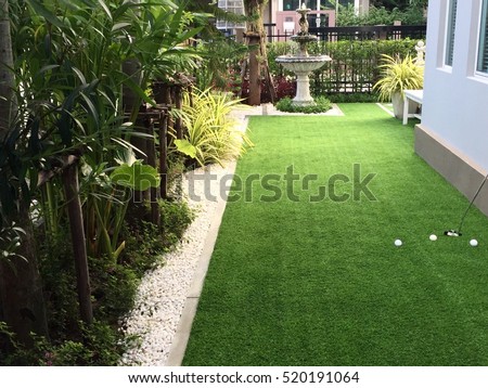 Home golf course, architecture design of grass field around home, artificial grass, fake grass Royalty-Free Stock Photo #520191064