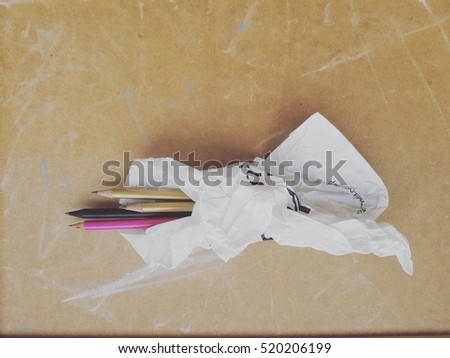 pencils in paper bag