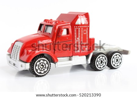 Isolated red toy truck side view macro photography 
