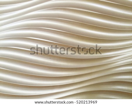 Golden seamless texture. Wavy background. Interior wall decoration. 3D interior wall panel pattern. golden background of abstract waves. Royalty-Free Stock Photo #520213969