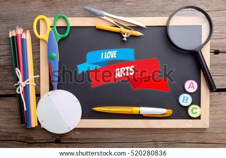 I LOVE ARTS on chalkboard with school stationery, colorful concept promoting good education. 