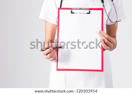 Doctor showing blank clipboard with pen isolated on a white background.
